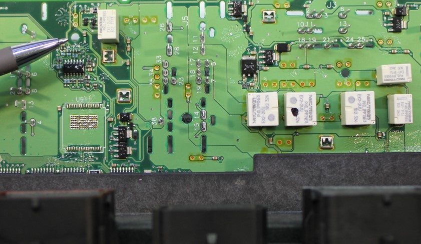 Location of the fuel pump relay soldered to one of six circuit boards inside a TIPM-7 series fuse box